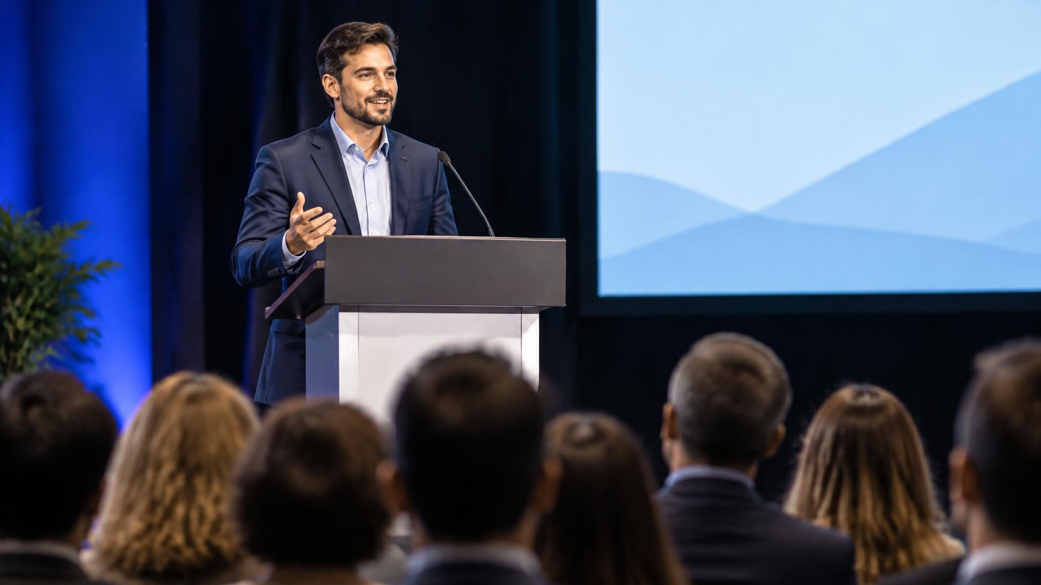 confident speaker on stage